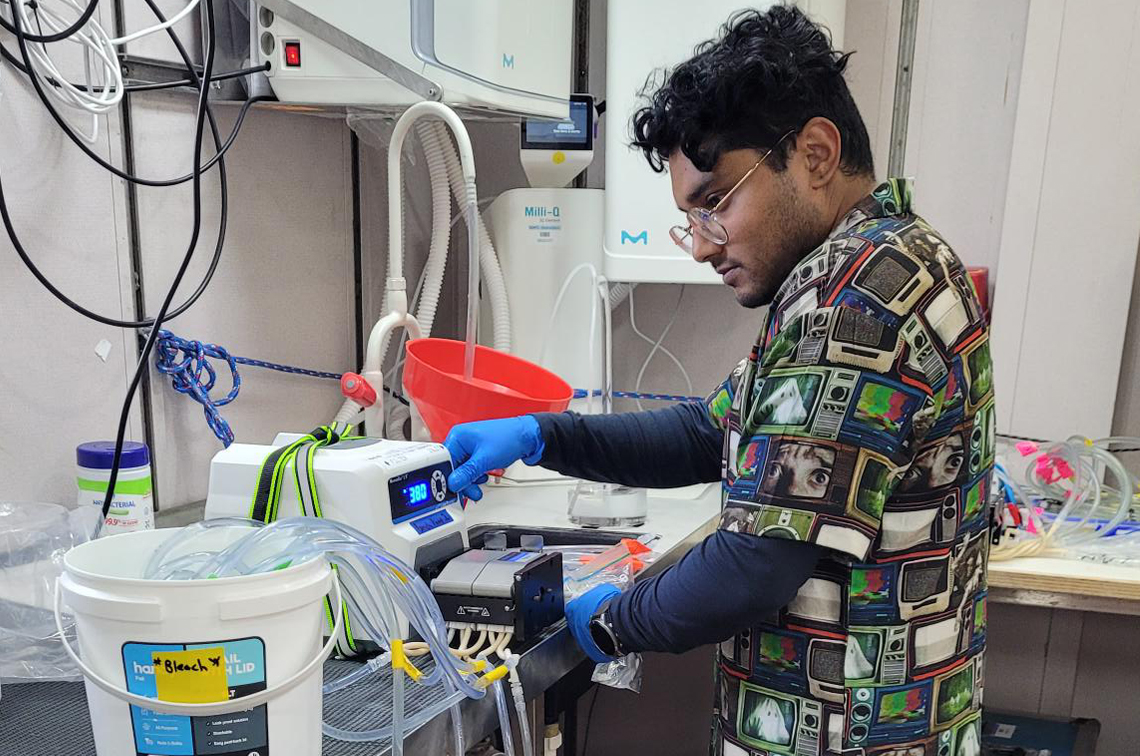 Sahan Jayasinghe cleans and prepares the vacuum filtration system prior to filtering eight 10-litre eDNA samples from the CTD. Image: CSIRO