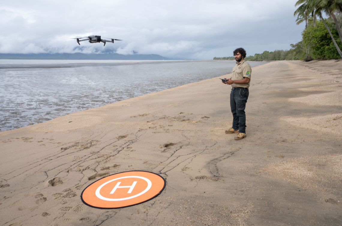 Doug Bulmer, Girringun Ranger, starting to fly a drone for intertidal seagrass surveys to monitor seagrass on Girramay Country in Cardwell, QLD. Image: Styledia.