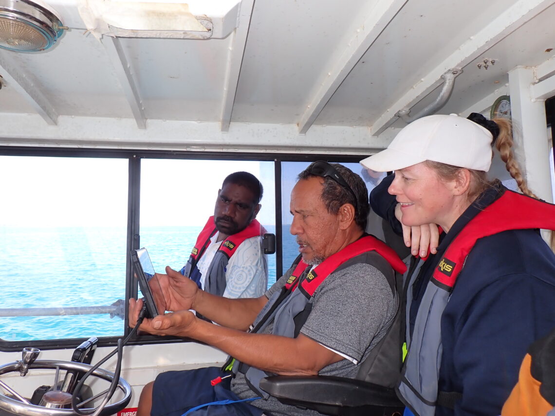 Karajarri Rangers, Andre Kitty (left), Humphrey Dean (middle), and Edith Cowan University researcher Dr Ankje Frouws (right) navigating to a survey site.